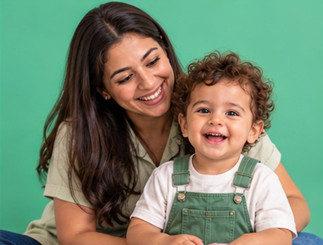 A Yippee teacher hugging a smiling toddler